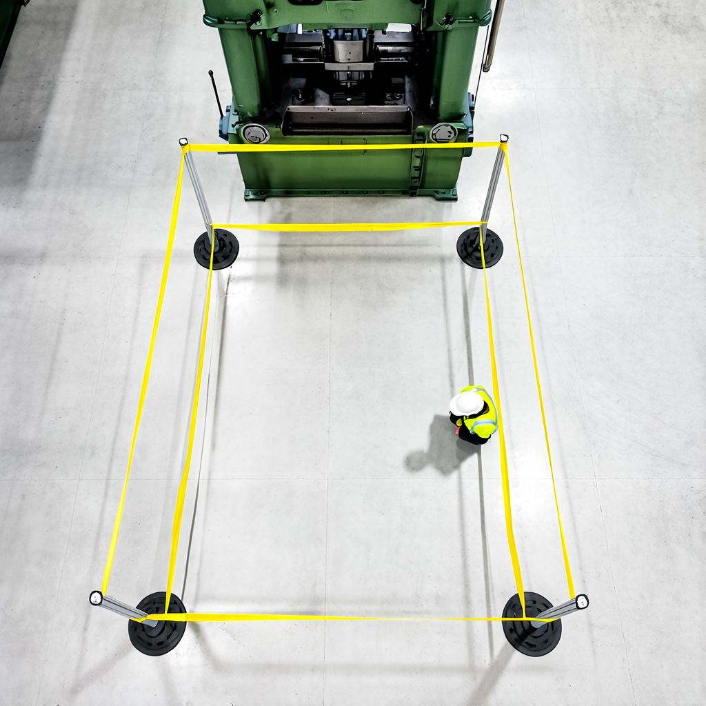 Camera frame of a person standing inside a taped-off floor area