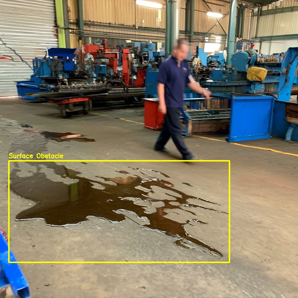 Workshop floor with an oil spill outlined as a hazard