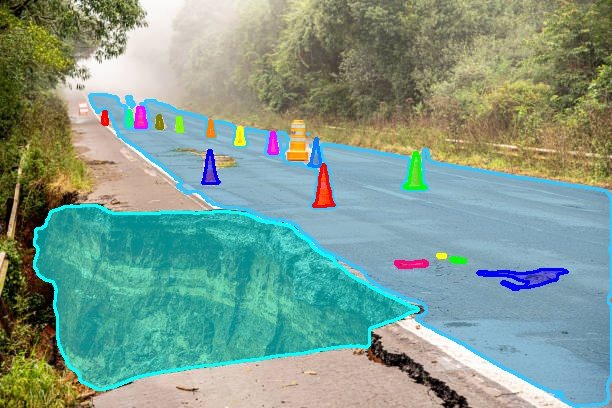 Collapsed road edge masked cyan with a line of cones each masked separately